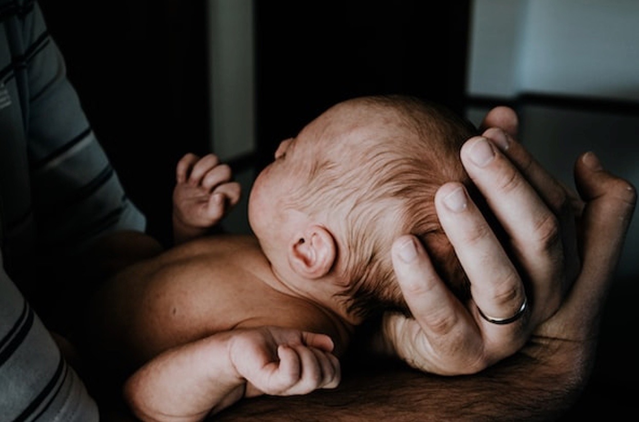 man holding baby